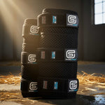 Set of black EQU StreamZ Horse boots in equestrian stable in summer light